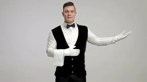 Butler gesturing with his hand Stock Footage