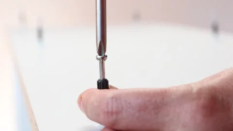 Butt joints with cam lock screw for assembly flatpack furniture made in Stock Footage 271194205