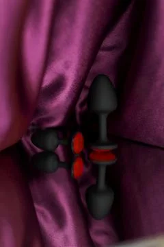Butt plug with soft touch plastic with red stone. Sex toy. Stock Photos