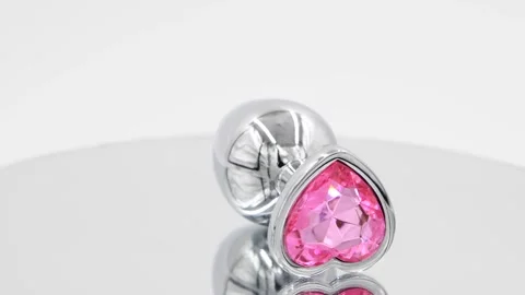 Butt plug spinning on mirror surface Stock Footage 277357457