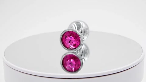Butt plug spinning on mirror surface Stock Footage 277357468