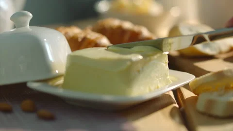 Butter and fresh bakery on the background during breakfast. Stock Footage 166159021