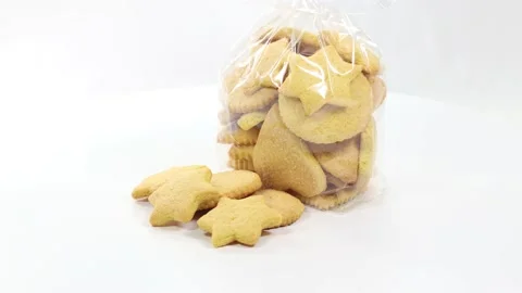 Butter baked biscuits in the shape of a star and heart Stock Footage 140669136