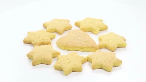 Butter baked biscuits in the shape of a star and heart Stock Footage 140669406