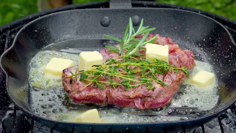 Butter Basting Steak, Gloved Chef Drops Butter Cubes Into Sizzling Pan Stock Footage 329277842