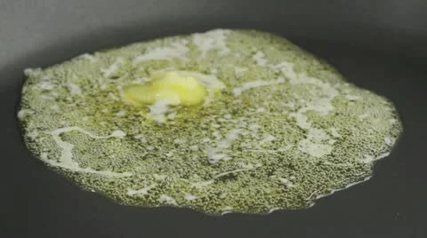Butter being heated in a pan Stock-Footage 24667865