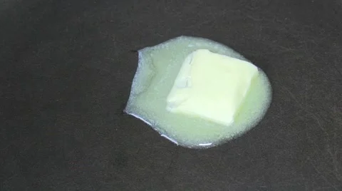 Butter being heated in a pan Stock Footage 62500347
