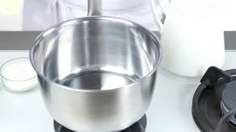 Butter being melted in a pot Stock-Footage 24671201