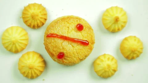 Butter biscuits with culinary paint painted with a percent sign surrounded by Stock Footage 98147766