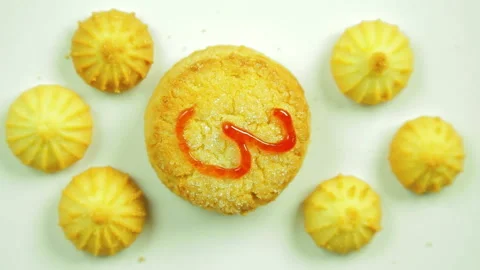 Butter biscuits with a painted figure of three culinary paint surrounded by Stock Footage 98094945