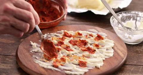 Butter board, tomato chilli condiment spreading Stock Footage 302383832