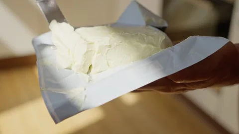 This butter boasts a smooth texture that is ideal for all your spreading Stock-Footage 313383206