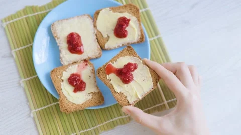 Butter on bread is captured in a close-up shot, emphasizing the small details Stock Footage 231072705