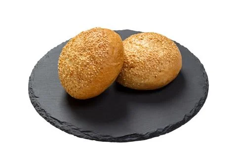 Butter bread roll on a plate on white background Foto stock