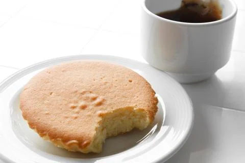 Butter cake with hot tea Stock Photos