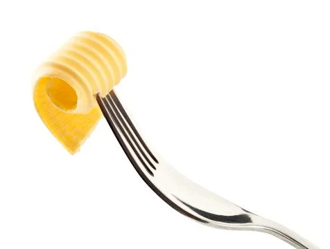 Butter curl on a fork Stock Photos