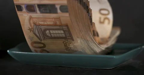 Butter dish opening reveals stack of 50 euro banknotes in super slow motion Stock Footage 337845485