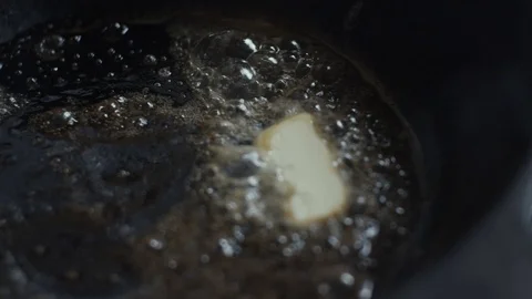 Butter on frying pan Stock Footage 125851913