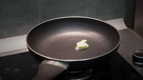 Butter on the frying pan Video stock 232131493