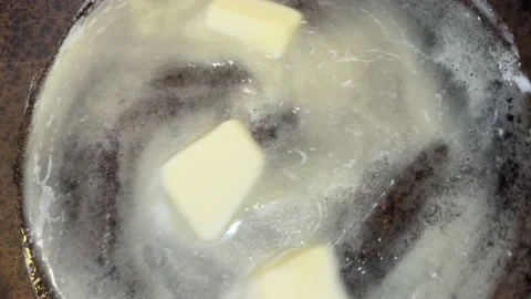 Butter is melted in the pan Stock Footage 221272174