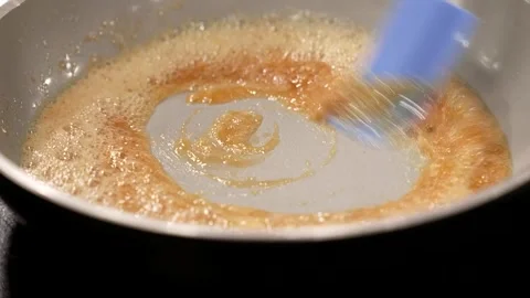 Butter melted in a pan Stock Footage 254423237