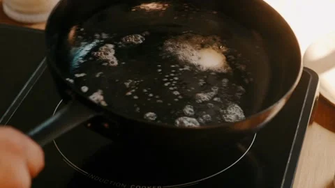 Butter melting over pan medium shot Stock Footage 339843232