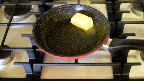 Butter melting in a pan Stock Footage 74957446