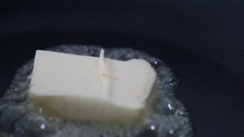 Butter melting in a pan. Stock Footage 90994086