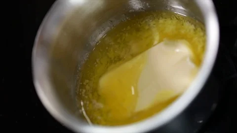 Butter Melting in a Pot High Angle Stock Footage 99138437