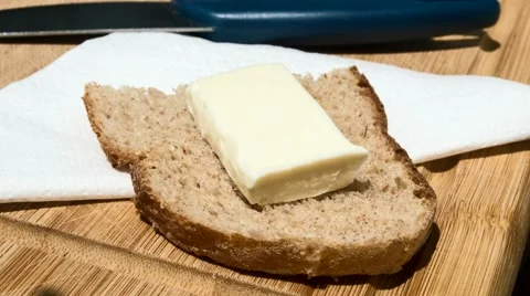 Butter melting on a slice of bread Video stock 52052526