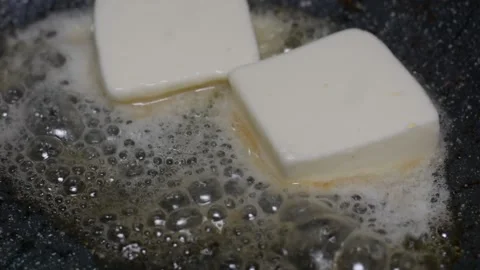 The butter melts in a ceramic pan Stock-Footage 150704270