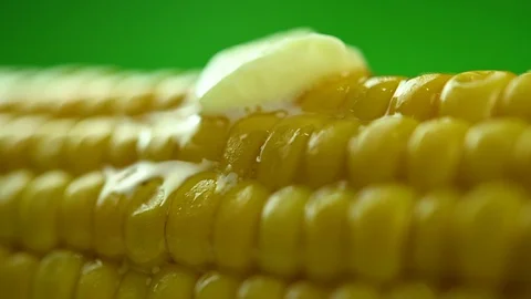 Butter melts on hot boiled corn Stock Footage 129093101