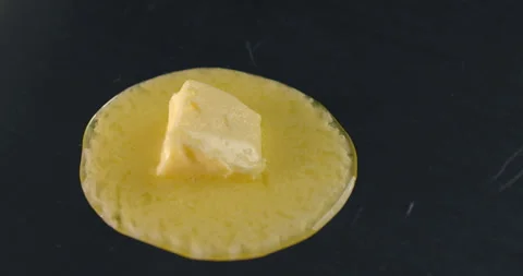 Butter melts in slow motion making the choux pastry Stock Footage 143590460