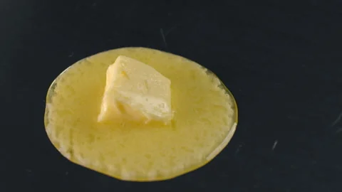 Butter melts in slow motion making the choux pastry Stock Footage 143590716