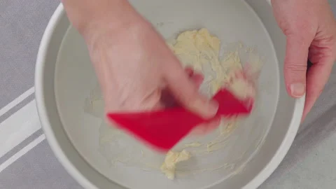 Butter a pan. Baking pan close-up on a kitchen table Stock Footage 232539436