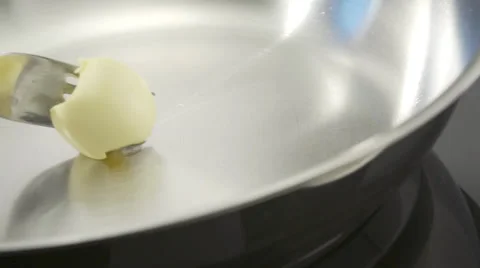 Butter in pan Stock Footage 33464846