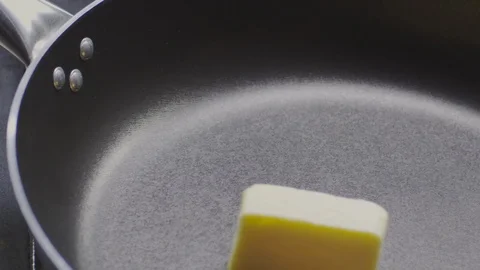 Butter in the pan Stock Footage 98299834