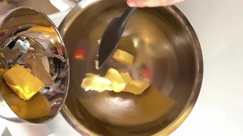 Butter is put into the metal container Stock Footage 228725671
