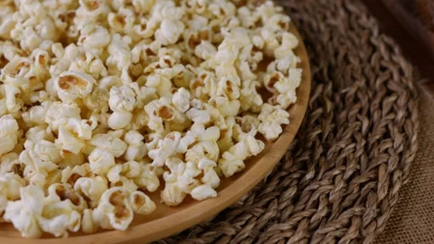 Butter salted popcorn on table. Stock Footage 309975845