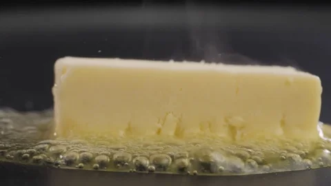 Butter Sizzling on the pan Stock Footage 85075305