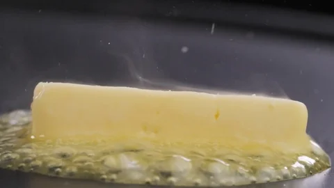 Butter Sizzling on the pan Stock Footage 85075317