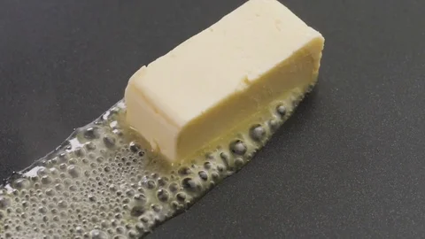 Butter Sizzling on the pan Stock Footage 85075435