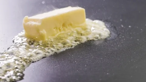 Butter Sizzling on the pan Stock Footage 85075521