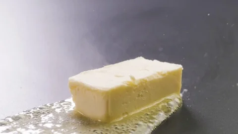 Butter Sizzling on the pan Stock Footage 85075552