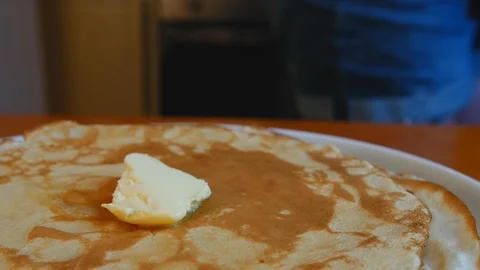 Butter slowly dissolves on hot pancake Stock Footage 121887370