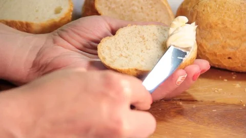 Butter spread on bread Video stock 76737133