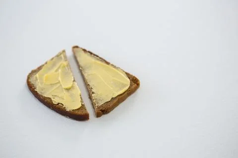 Butter spread on bread slice Stock Photos