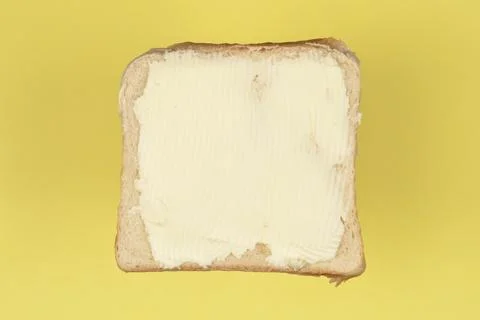 Butter Spread on White Bread Slice Stock Photos