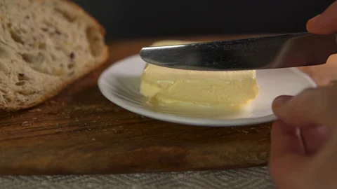 Butter on the white plate Stock-Footage 130117722
