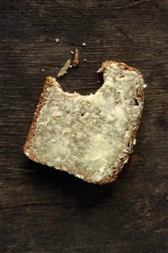 Buttered bread with bite missing Stock Photos